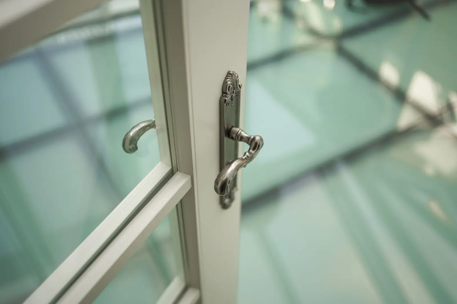 Close-up of an office door handle and frame