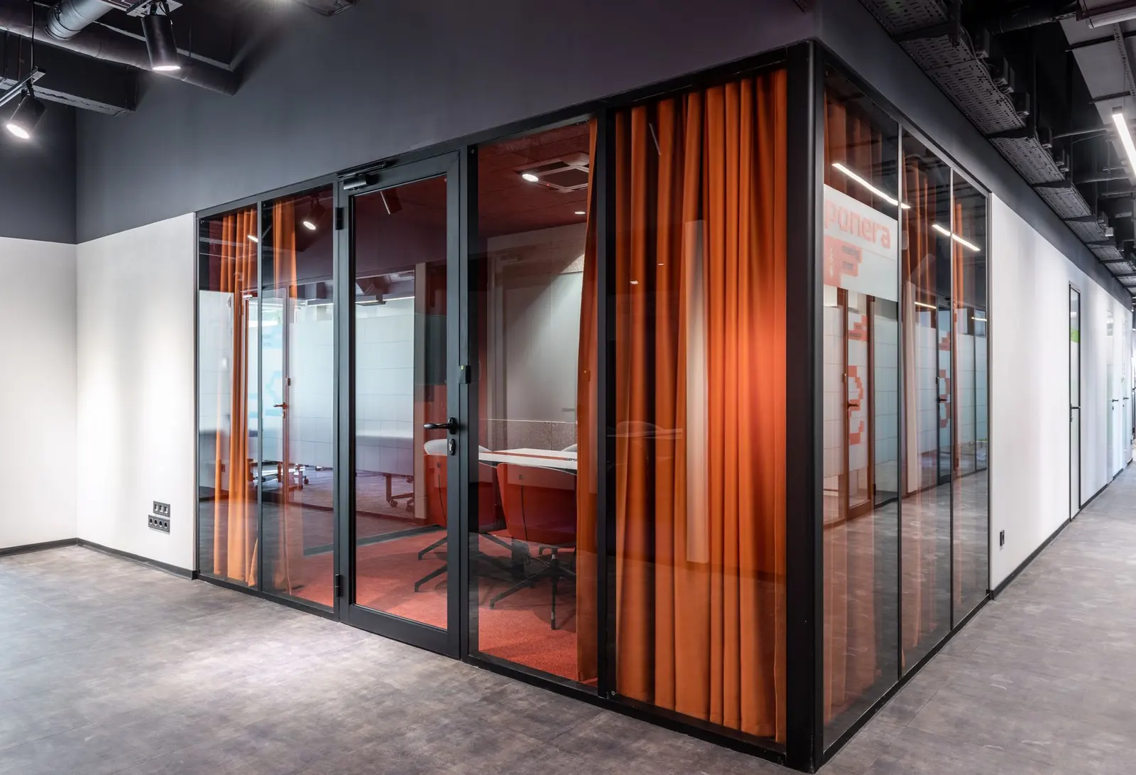 An office corridor with doors along one side